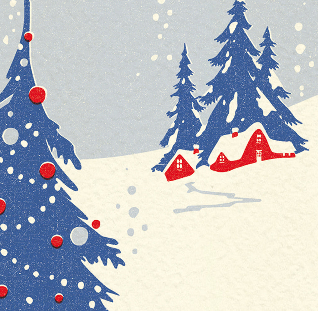 A Christmas card and envelope in red and blue featuring a stylised illustration of a cosy house in front of pine trees in a snowy landscape with smoke curling up from the chimney. 